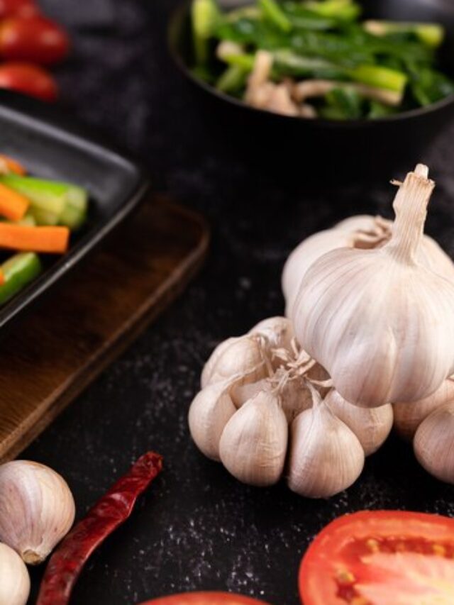 garlic-tomato-forks-cooking-selective-focus_1150-25296