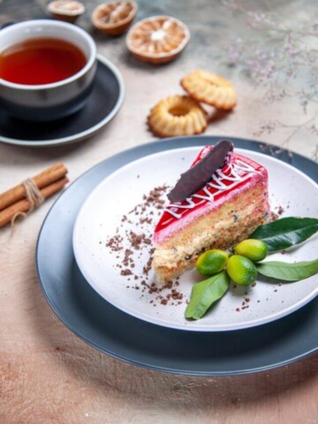 side-close-up-view-cake-cake-with-chocolate-citrus-fruits-cup-tea-cookies-cinnamon